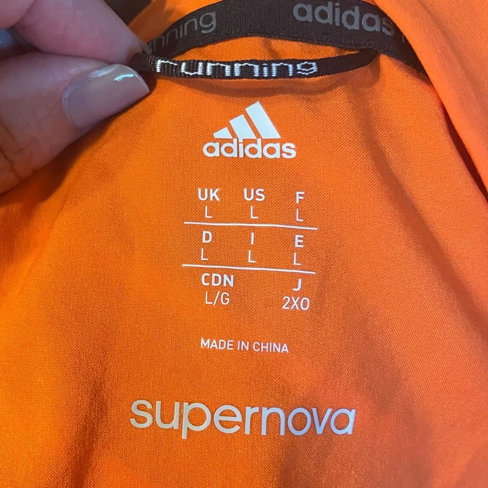 ADIDAS “supernova” lightweight running zip up jacket /orange w/reflective thread